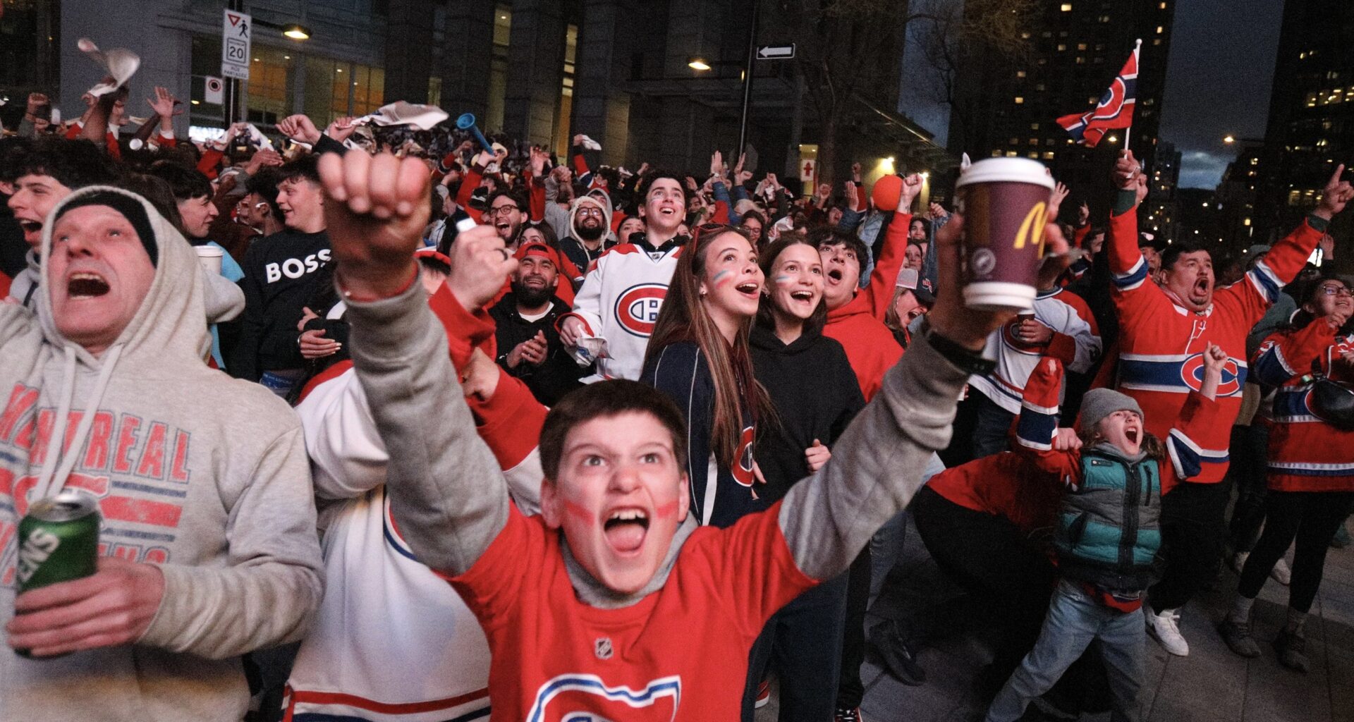 Fans outside the Bell Centre cheer a second-period goal by the Canadiens against the Sabres during Game 3 Sunday night.