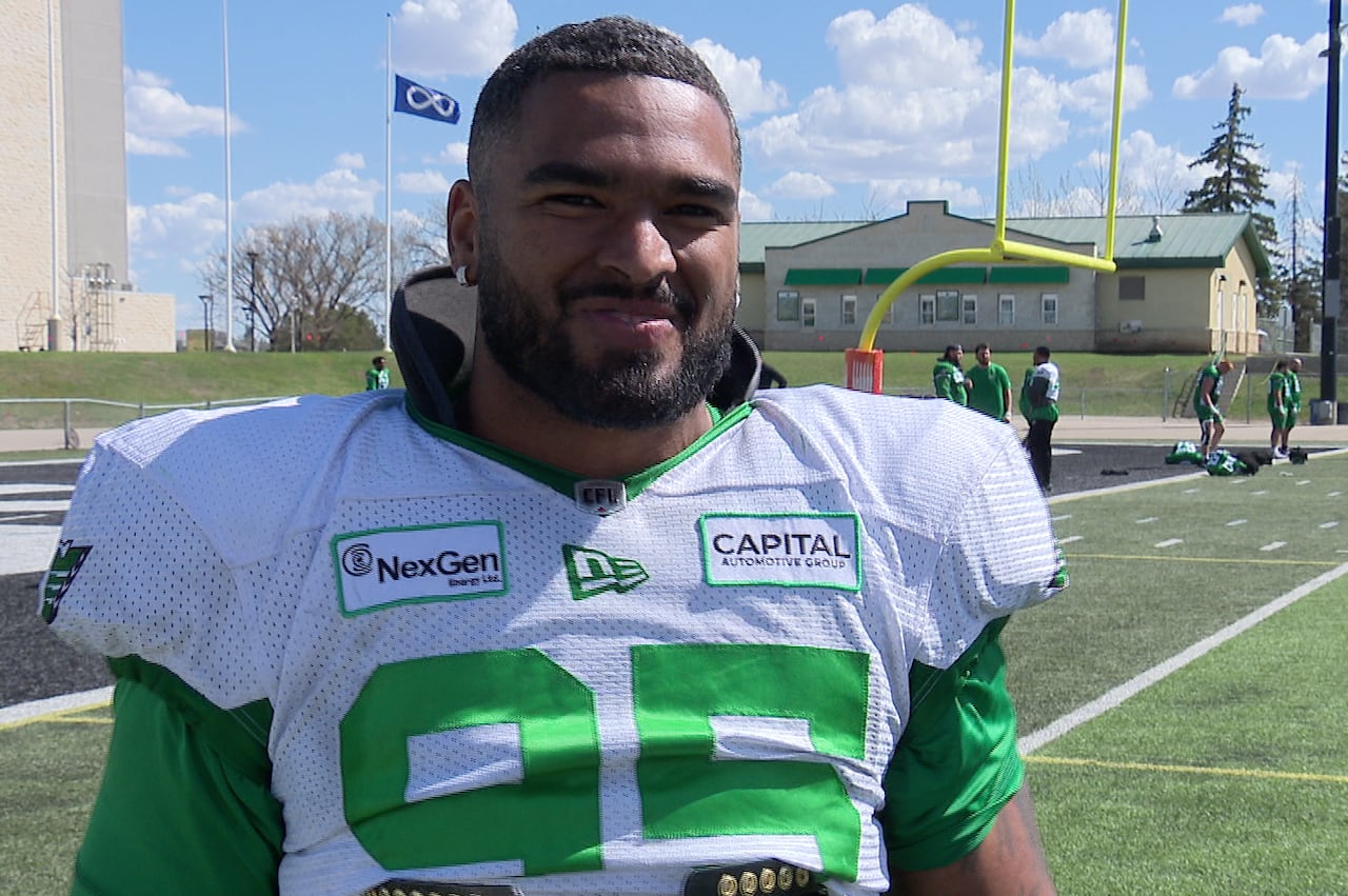 Football player talking to the media.