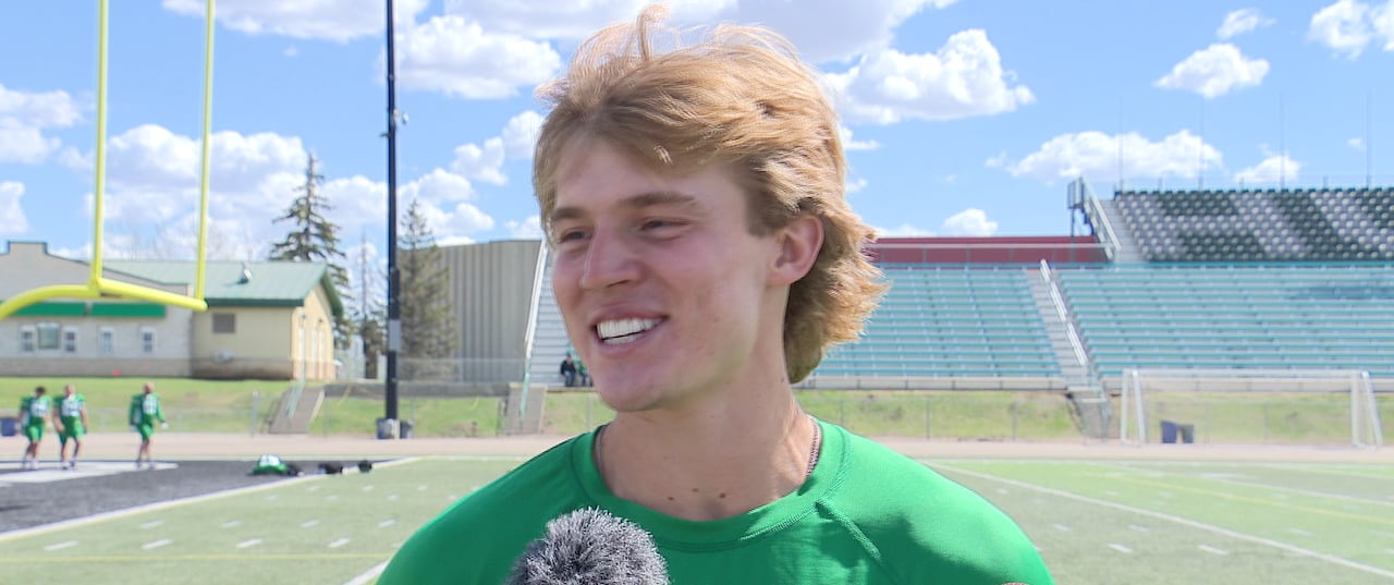 A football player talking to the media.