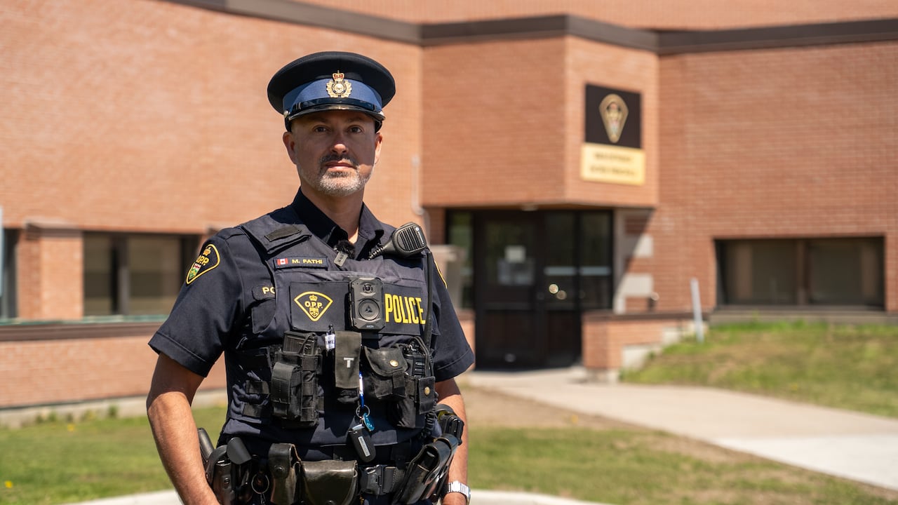 OPP Constable Michael Fathi stands in front of Ottawa OPP detachment building
