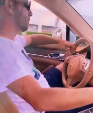 man driving car