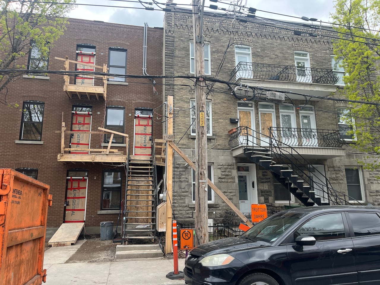 Two boarded up apartment buildings.