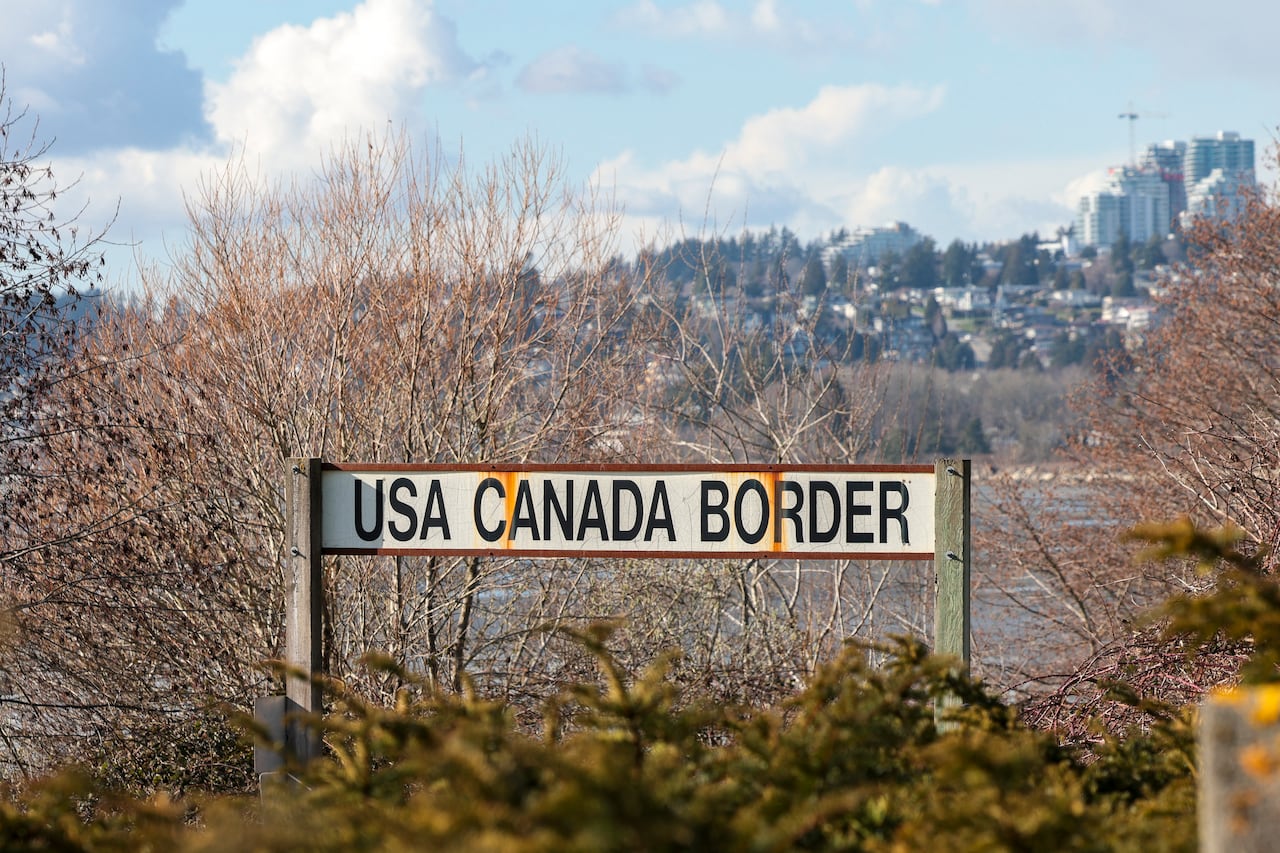 A sign for the US-Canada border is pictured at the Peace Arch border crossing in Blaine, Washington, on March 5, 2025.