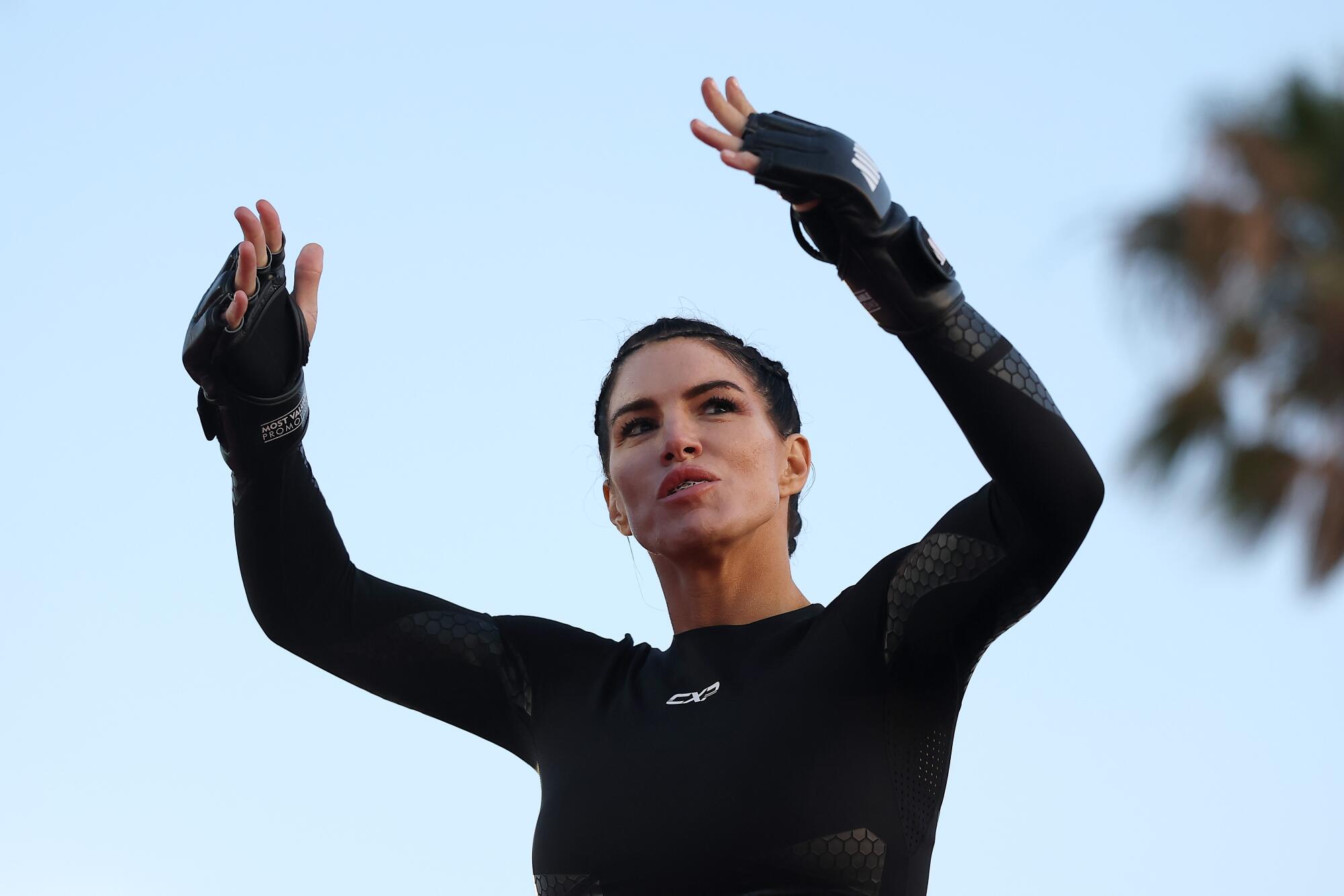 Gina Carano participates in an open workout Wednesday at Venice Beach ahead of her Netflix MMA bout with Ronda Rousey.