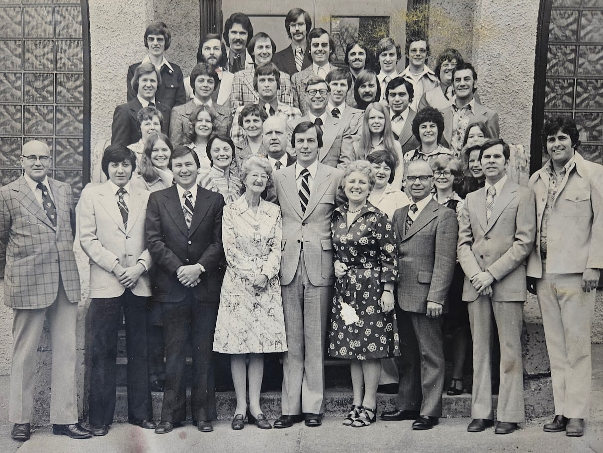 A black and white photo depicting  station staff from CHNS's 50th anniversary in 1976