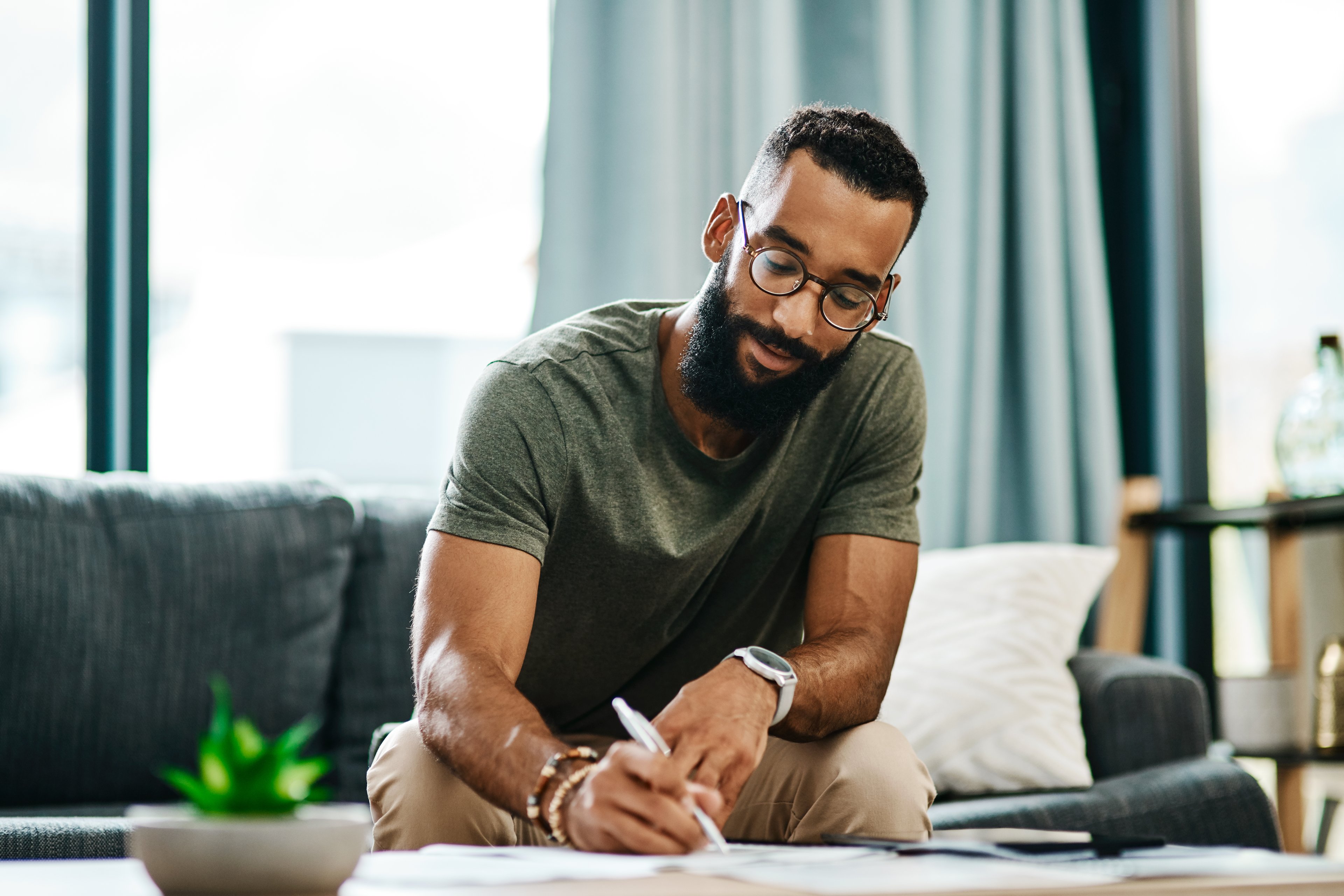 Adult looking at financial paperwork.