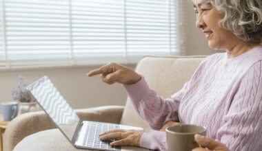 senior couple and documents with laptop for finance, budget planning or retirement annuity on sofa.