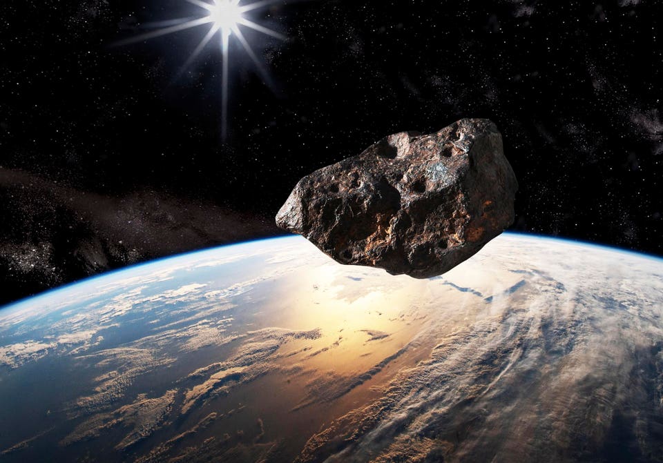 A large asteroid moving toward the upper atmosphere of Earth. Today, NASA continues to monitor the potential threat to Earth from deep space asteroids.