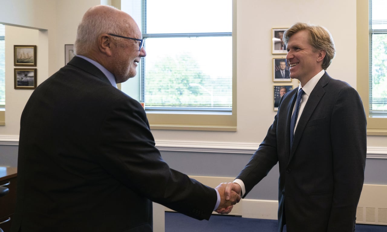 Two men shaking hands.