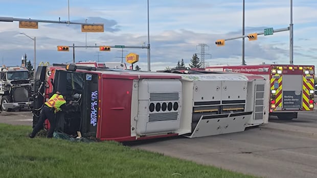 3 taken to hospital after Calgary Transit bus rolls over on impact with semi-truck