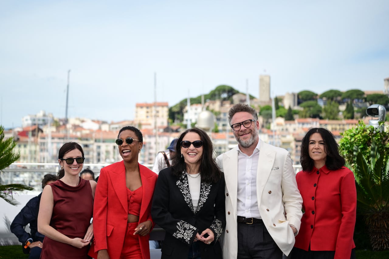 Hollywood stars pose for the camera in front of the boats and hills of Southern France.
