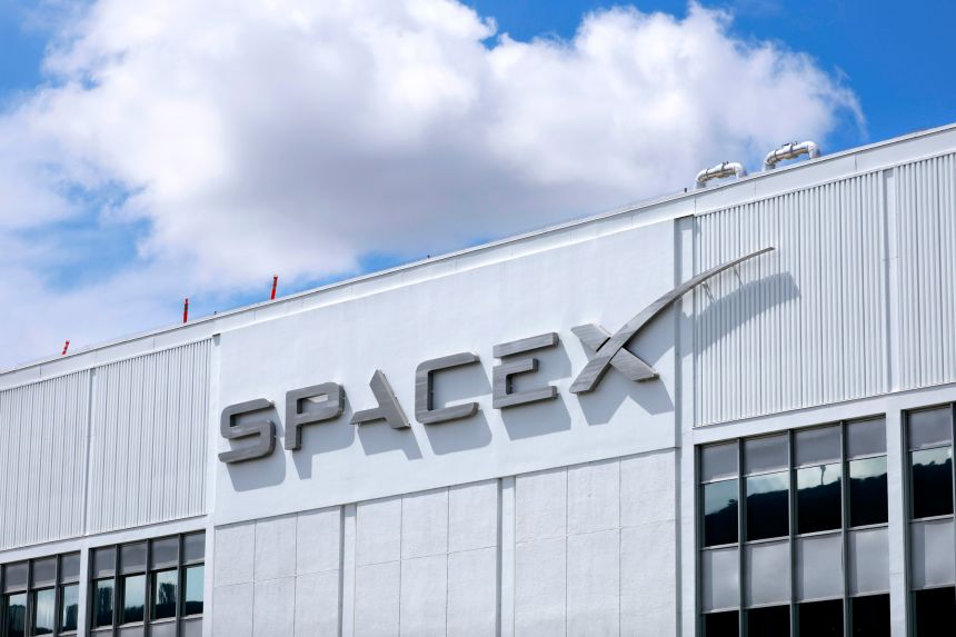The SpaceX logo is displayed at a SpaceX facility on April 2, 2026 in Hawthorne, California. Elon Musk’s rocket and satellite company SpaceX has filed for an initial public offering (IPO).