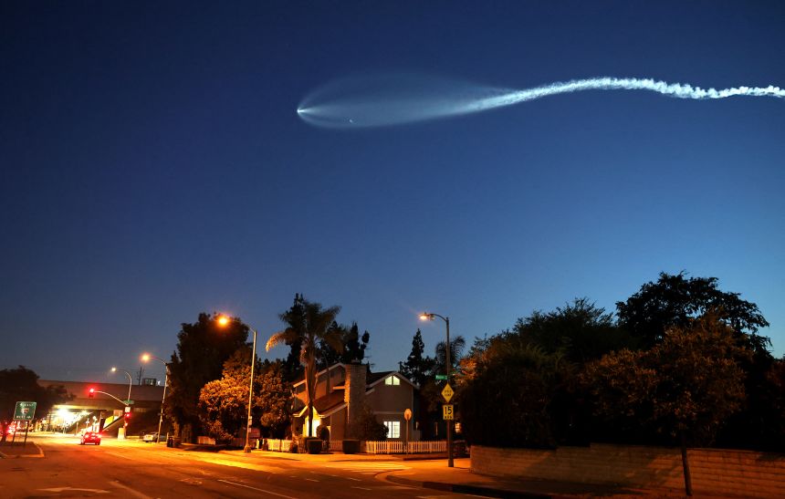 A SpaceX Falcon 9 rocket rises after launching from Vandenberg Space Force Base carrying 26 Starlink internet satellites on June 16, 2025 as seen from Pasadena, California.