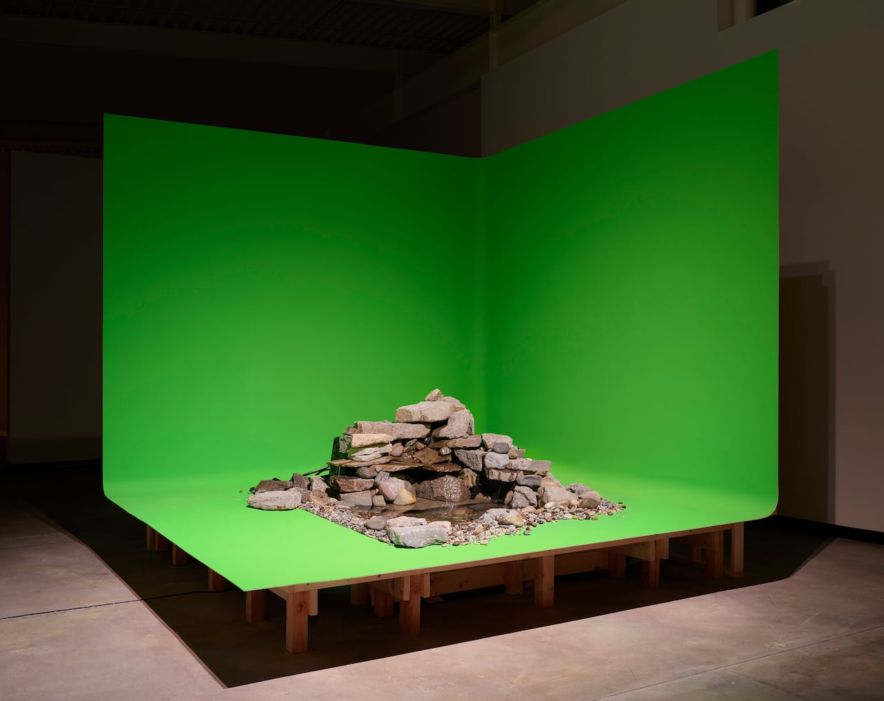 A pile of concrete pieces on a neon green background