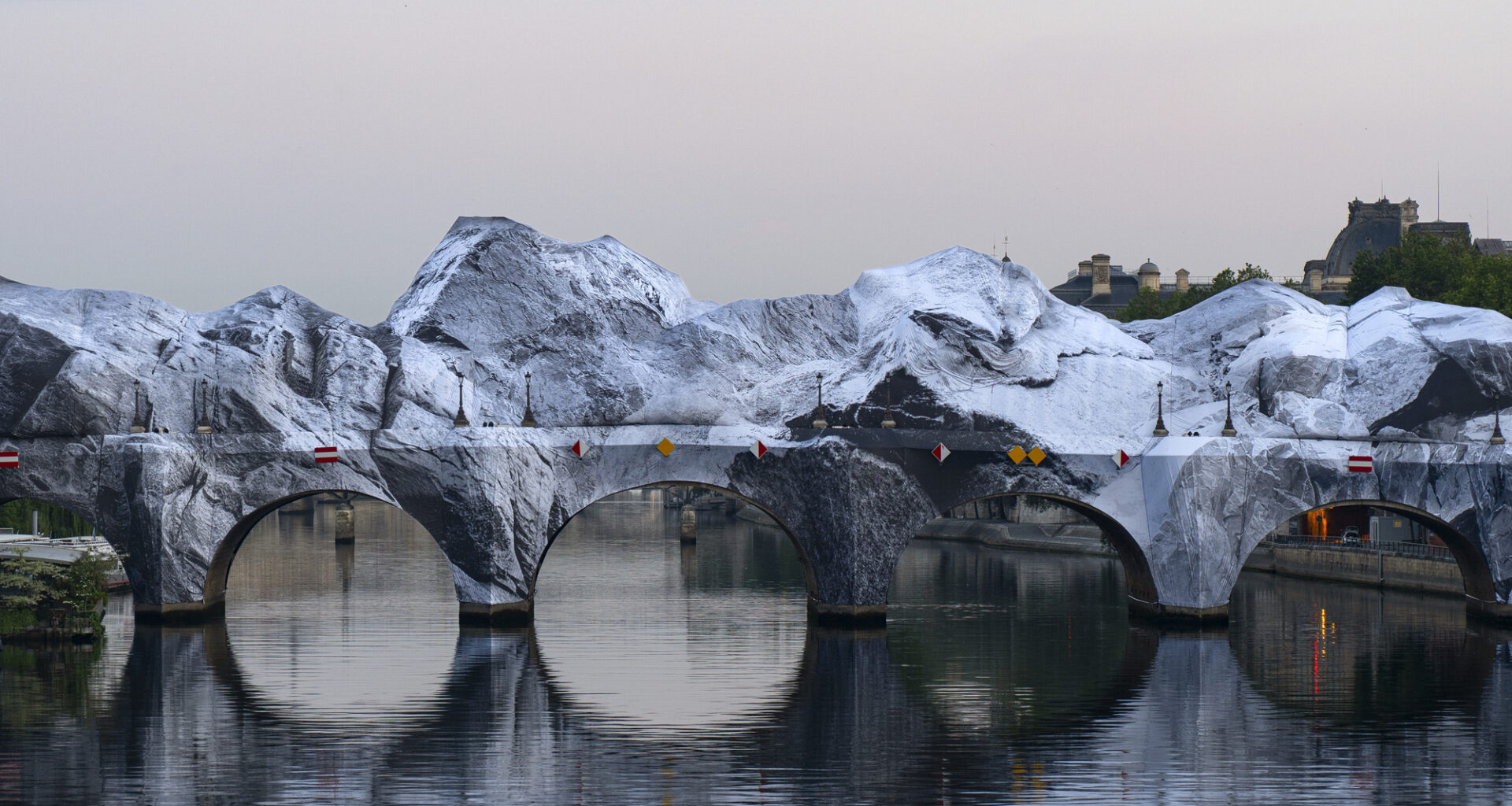 Street Artist JR Installs an Inflatable Cave on Paris' Pont Neuf in Tribute to Christo and Jeanne-Claude