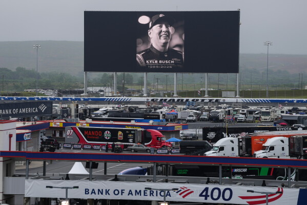 An in memoriam photo of former driver Kyle Busch is displayed on the video board of the backstretch at Charlotte Motor Speedway, Friday, May 22, 2026, in Charlotte, N.C. (AP Photo/Matt Kelley)