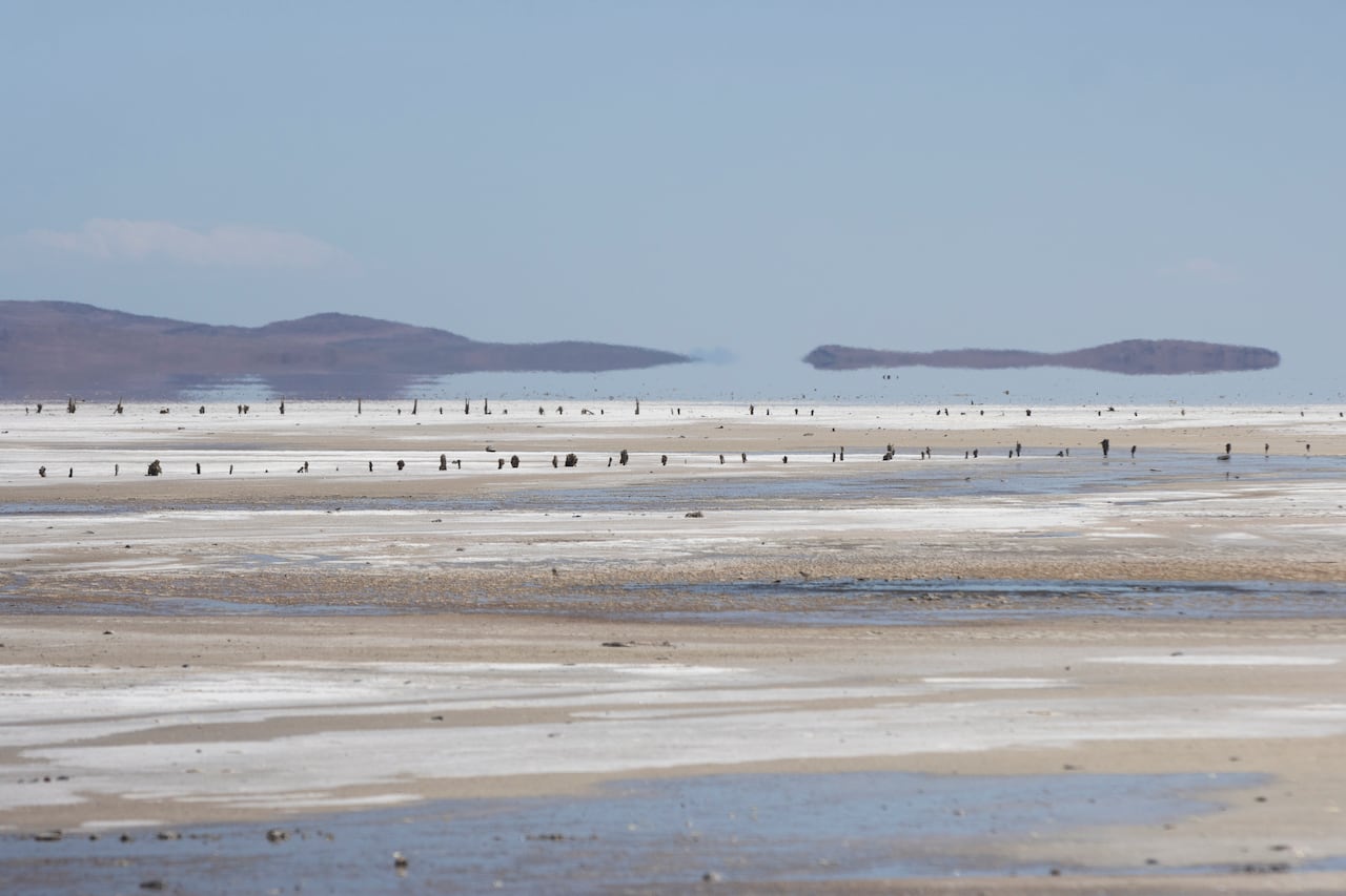 A view of the exposed lake bed of a large lake with low water levels.
