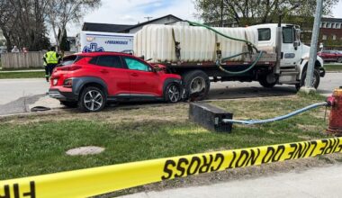 Man, 49, dead after vehicle collides with water truck parked along west Winnipeg street, police say