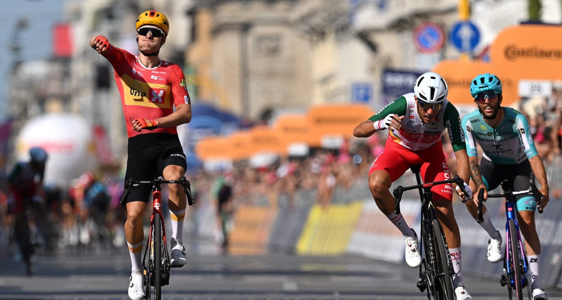 MILAN, ITALY - MAY 24: (L-R) Fredrik Dversnes Lavik of Norway and Team Uno-X Mobility celebrates at finish line as stage winner ahead of Mirco Maestri of Italy and Team Polti VisitMalta and Martin Marcellusi of Italy and Team Bardiani CSF 7 Saber during the 109th Giro d'Italia 2026, Stage 15 a 157km stage from Voghera to Milan / #UCIWT / on May 24, 2026 in Milan, Italy. (Photo by Tim de Waele/Getty Images)