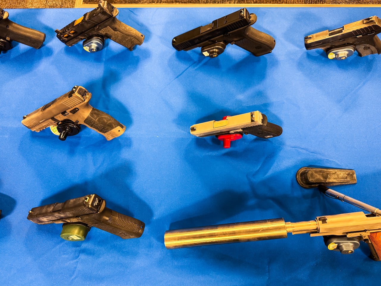 Handguns positioned on a desk
