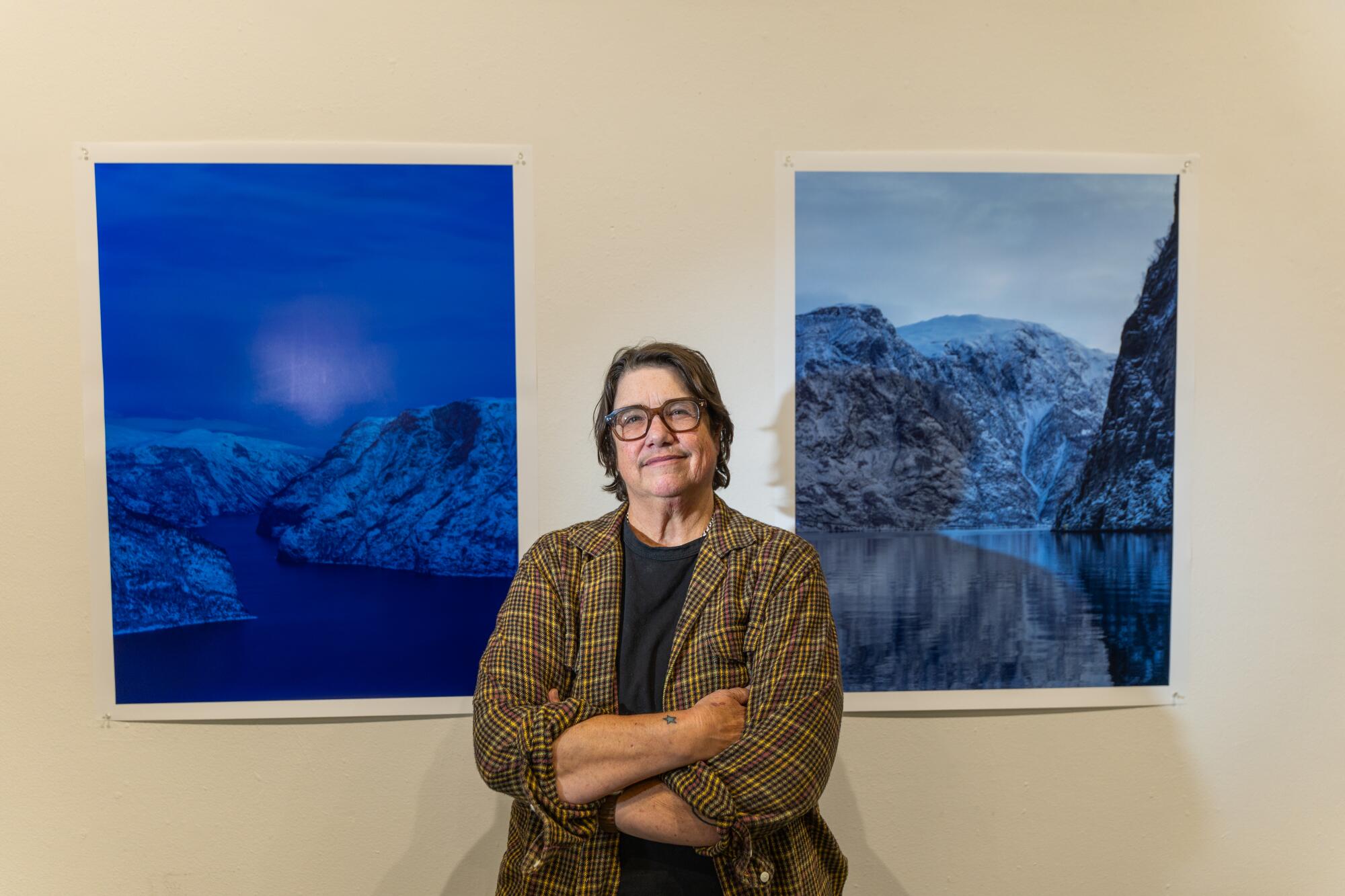 A photographer with her work.