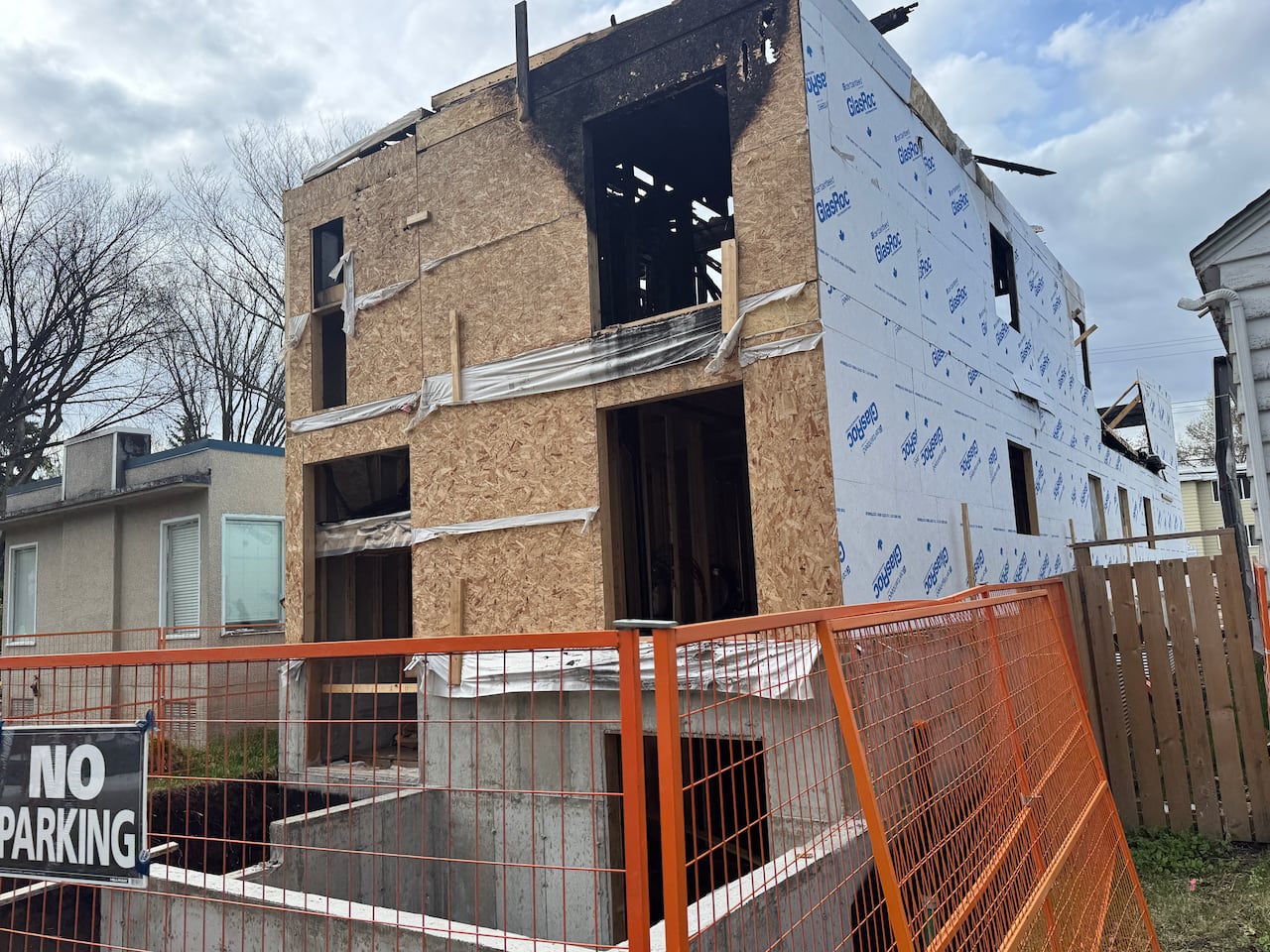 Damage is shown on a home that was under construction when it caught fire.