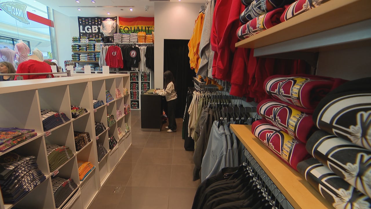 The inside of a clothing store in a shopping mall.