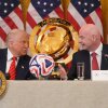 President Trump and FIFA President Gianni Infantino talk during a FIFA task force meeting in the East Room of the White House, May 6, 2025, in Washington.