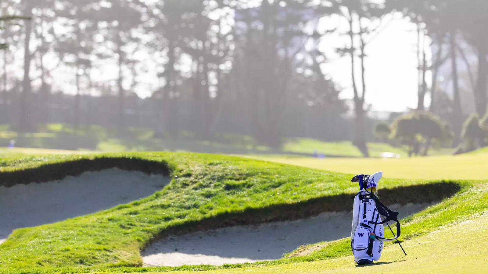 Emil Herstad and Finn Koelle walk with their bags alongside head coach Alan Murray during the final round of the NCAA Corvallis Regional