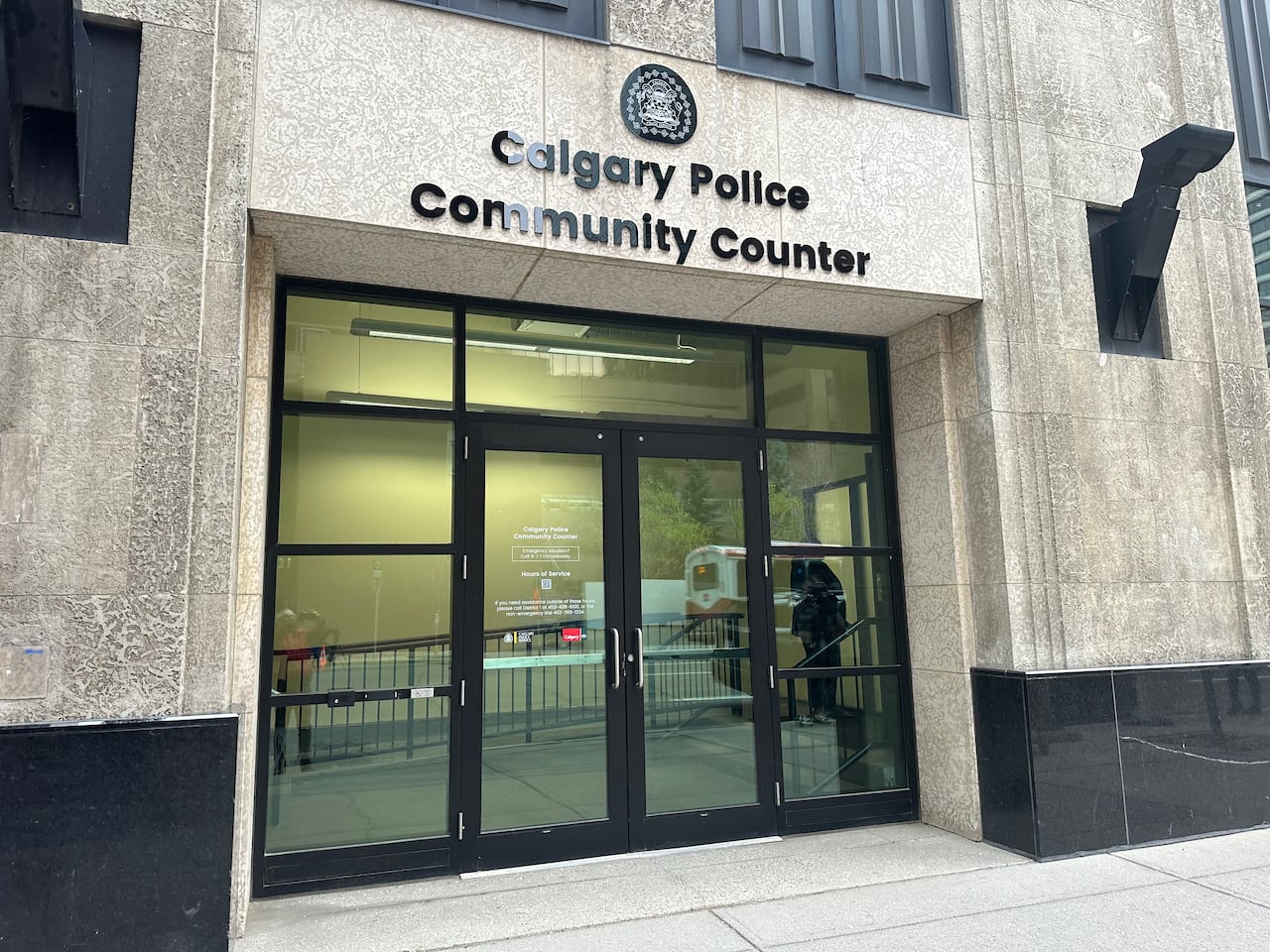 a building reads "Calgary Police Community Counter"