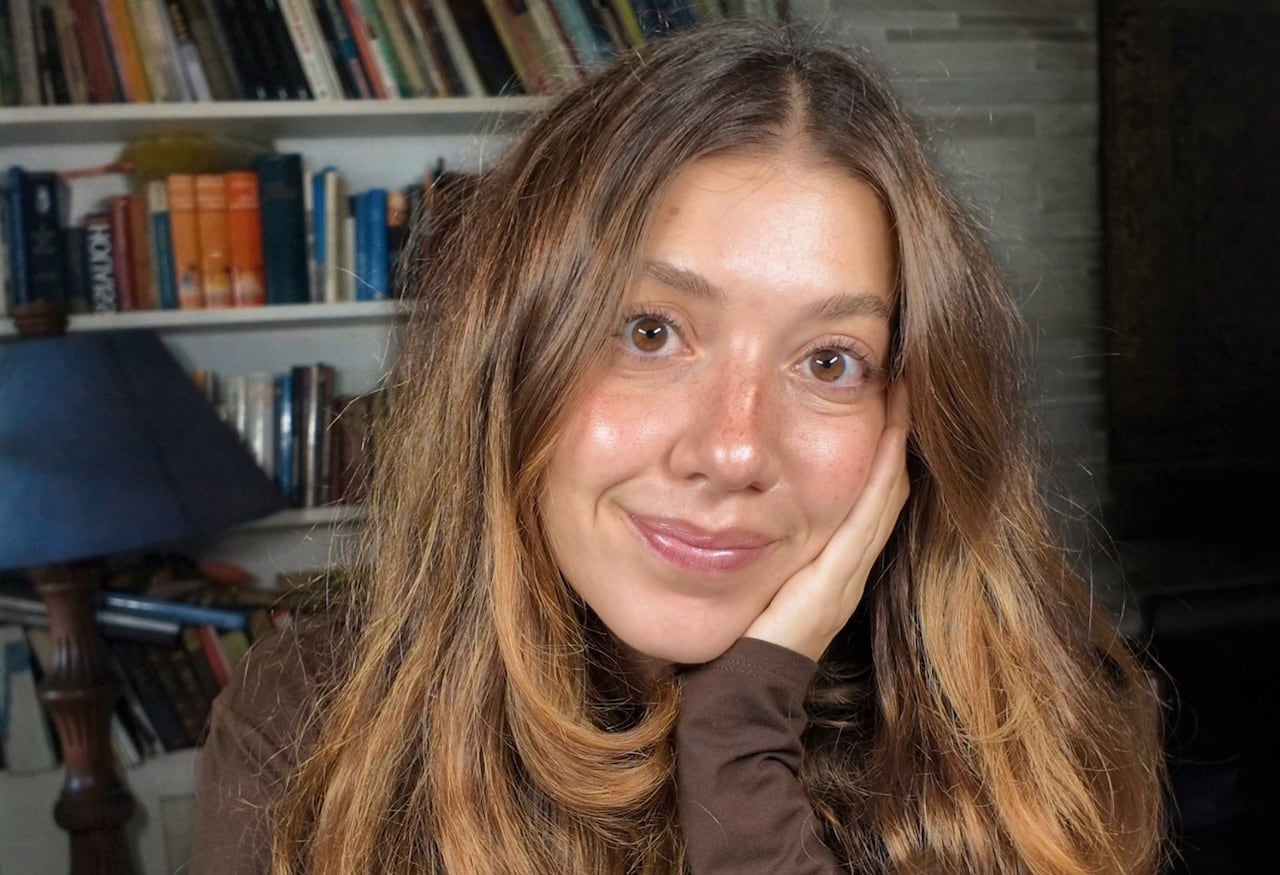 A smiling woman poses for a photo