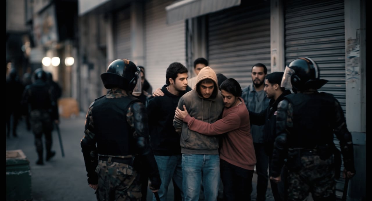 A scene from an AI-generated movie where a group of people huddle while encircled by riot police.