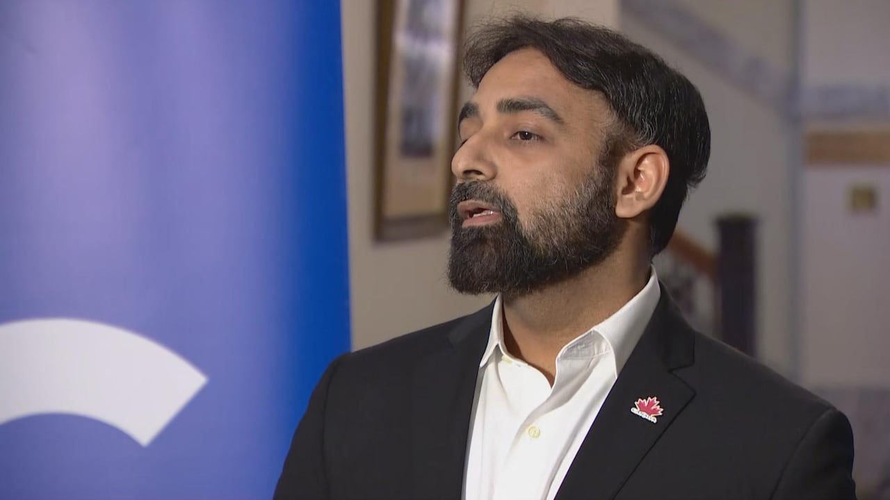 A man with a beard speaks