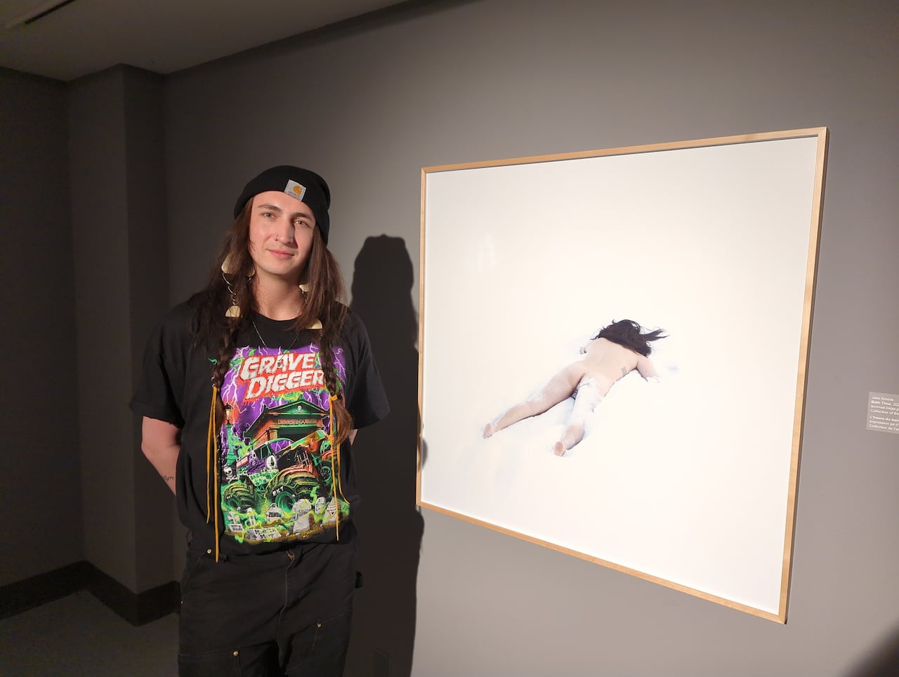A person standing in front of an image of themselves