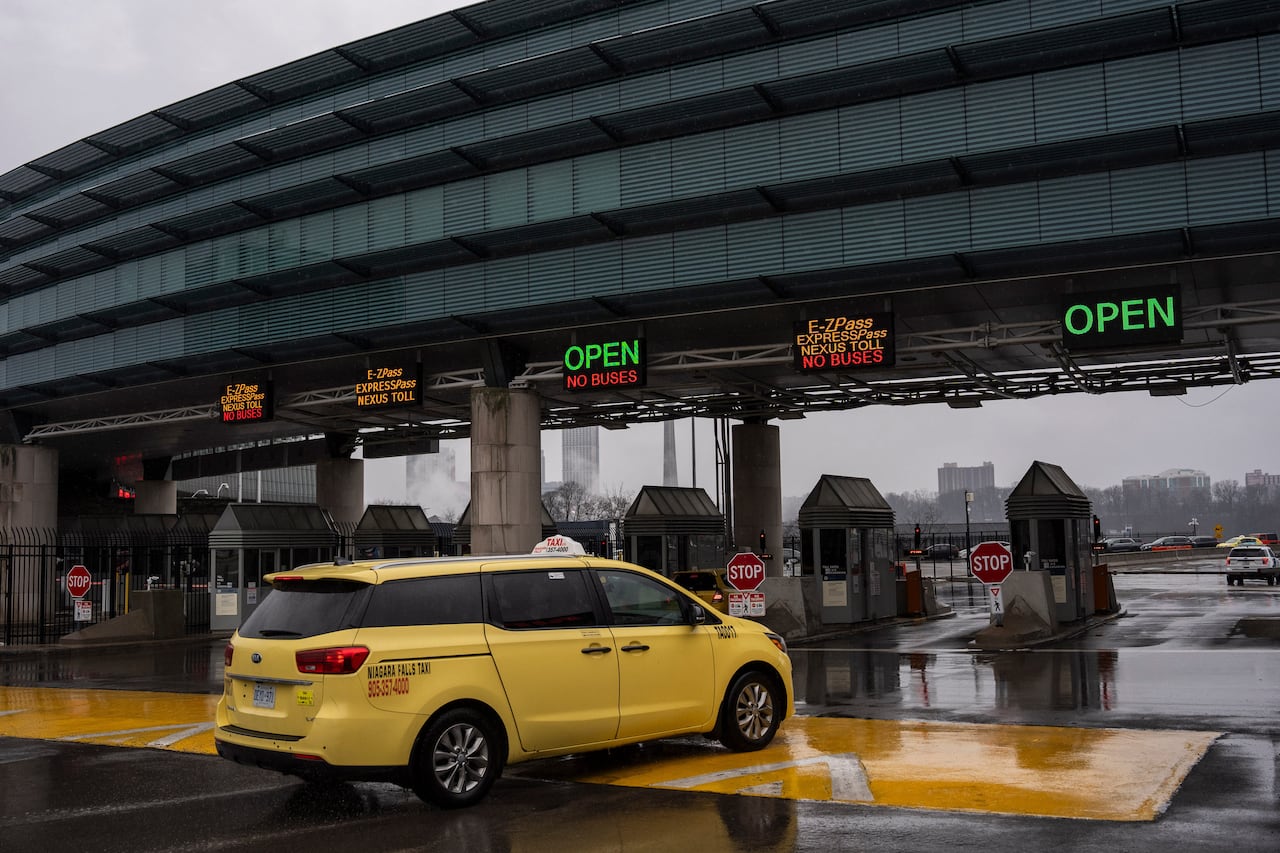 A car drives towards the Rainbow Bridge US-Canada border crossing