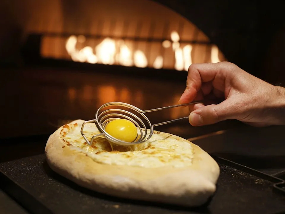 At Yan’s Restaurant on Murray Street, Khachapuri is a boat-shaped bread with a cheese and egg filling.