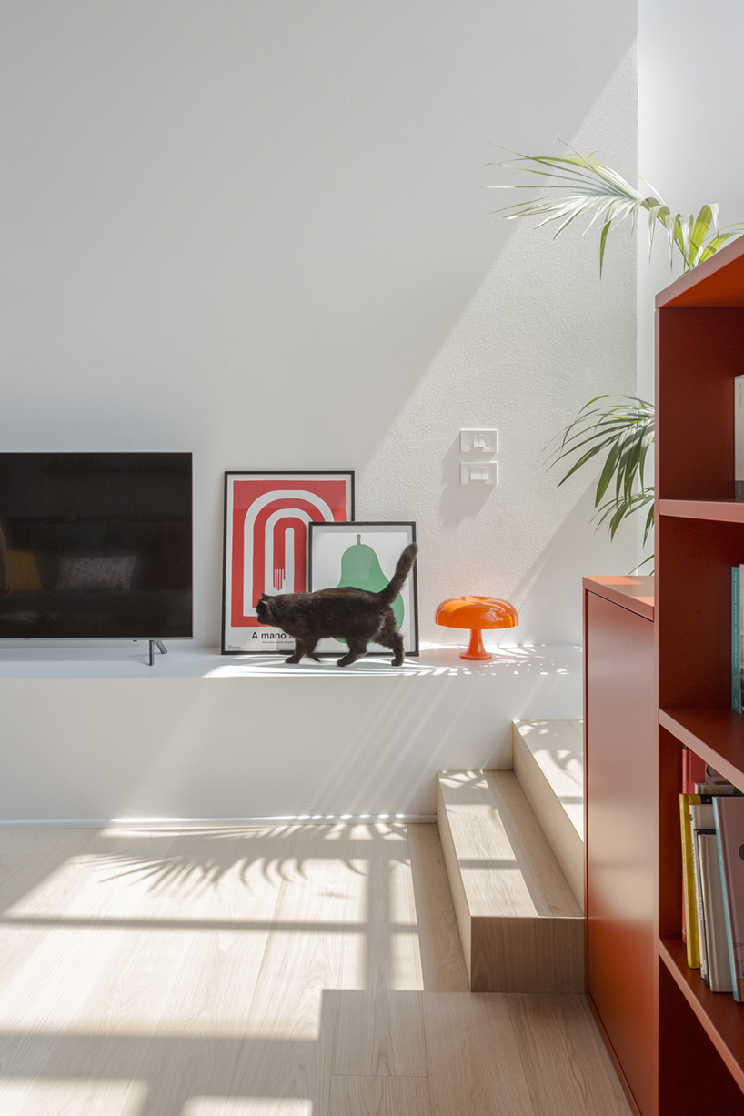pop colors animate geometric interiors within renovated 1960s apartment in italy - 7
