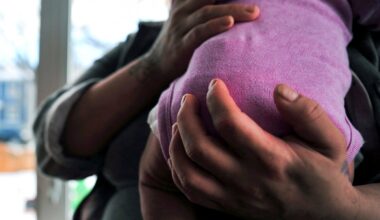 Health workers attend to a mother and her infant at the Mother and Child Hospital, in Kasoa, Ghana, on November 19, 2025.