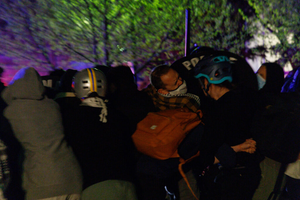 Calgary police rail on demonstrators at an encampment on the University of Calgary grounds in Calgary on Thursday, May 9, 2024
