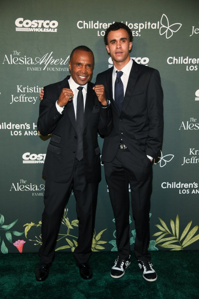 Sugar Ray Leonard and Daniel Ray Leonard pose for a photo.