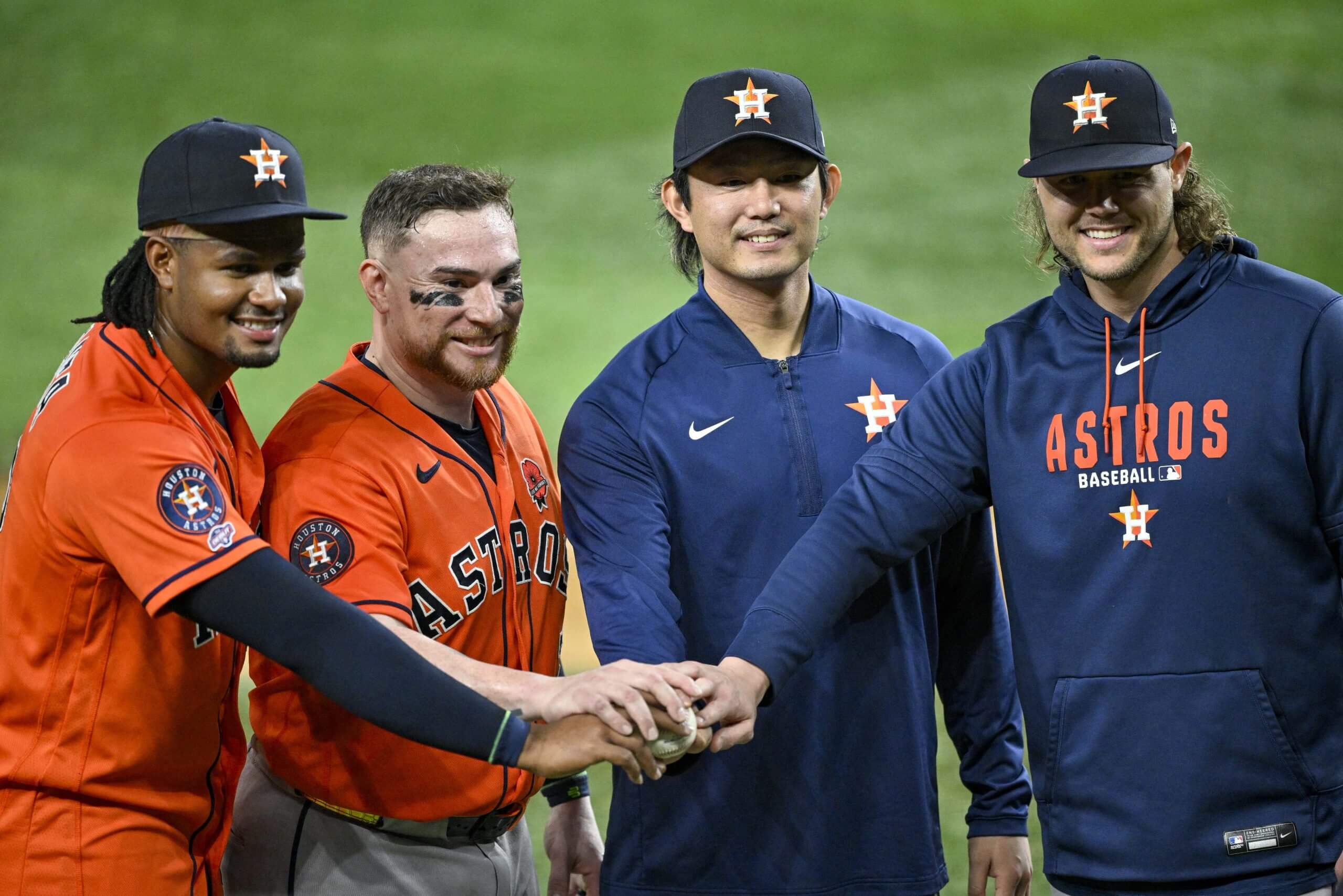 Houston Astros players, from left, reliever Alimber Santa, catcher Christian Vázquez, starting pitcher Tatsuya Imai and reliever Steven Okert pose with the game ball after the Astros pitched a combined no hitter against the Texas Rangers on Monday.