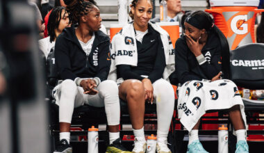 Aces guard Chelsea Gray, center A'ja Wilson and Aces guard Jackie Young (0) talk on the si ...