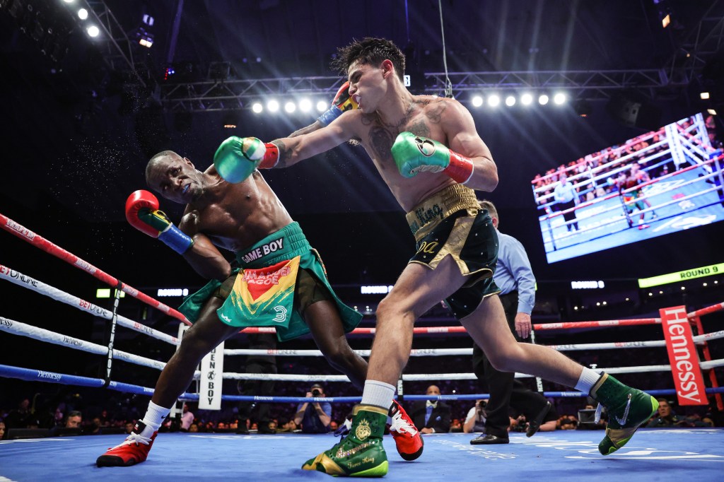 Ryan Garcia connects a punch to Emmanuel Tagoe's face during their boxing match.