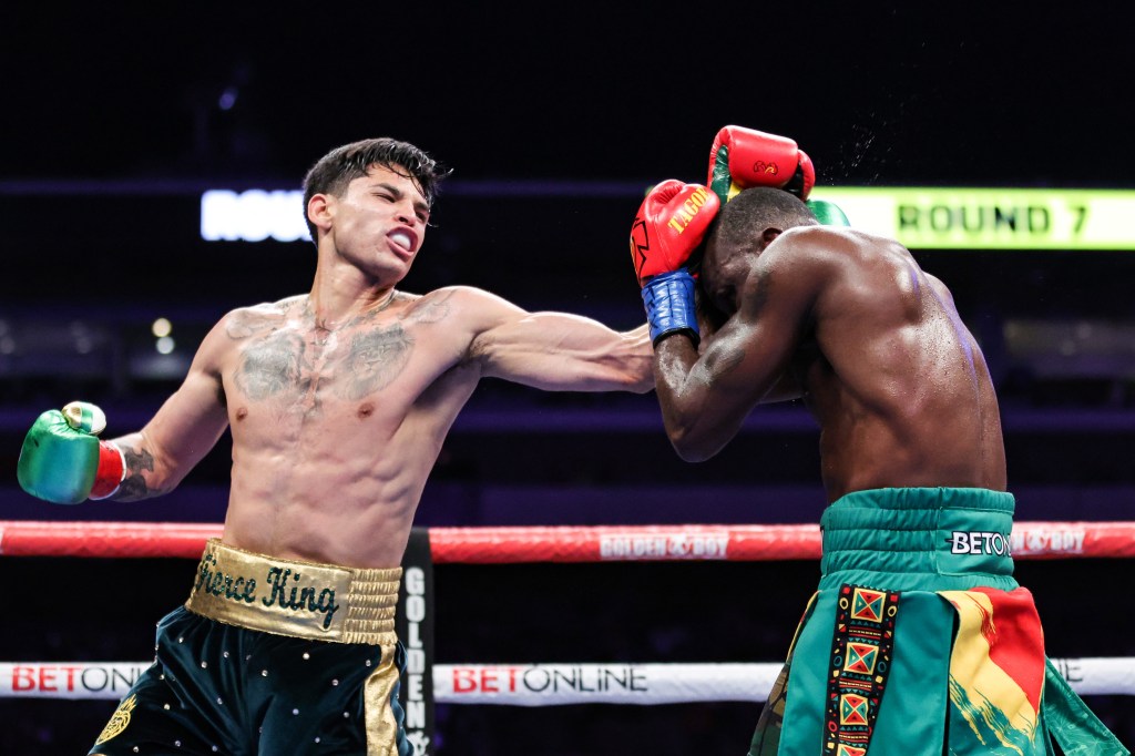 Ryan Garcia punching Emmanuel Tagoe in a boxing match.
