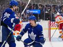 Matthew Knies #23 of the Toronto Maple Leafs celebrates his second period goal against the Calgary Flames with William Nylander #88 at Scotiabank Arena on October 28, 2025 in Toronto, Ontario, Canada.