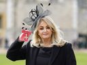 Welsh singer Gaynor Sullivan aka Bonnie Tyler poses with her medal after being appointed a Member of the Order of the British Empire (MBE) during an investiture ceremony at Windsor Castle on February 1, 2023.  