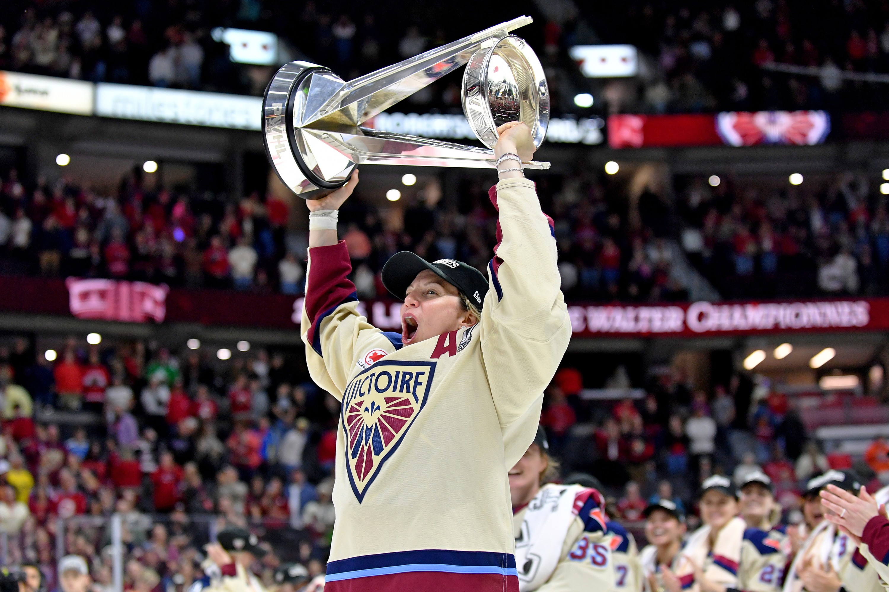 Laura Stacey hoists the Walter Cup.