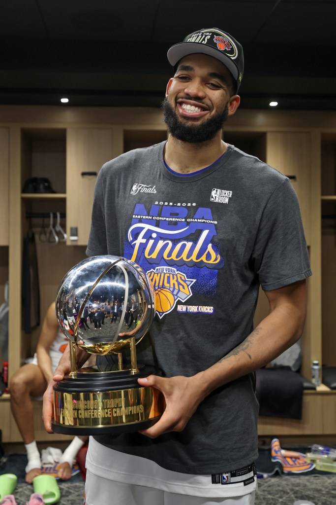 Karl-Anthony Towns celebrates in the locker room.