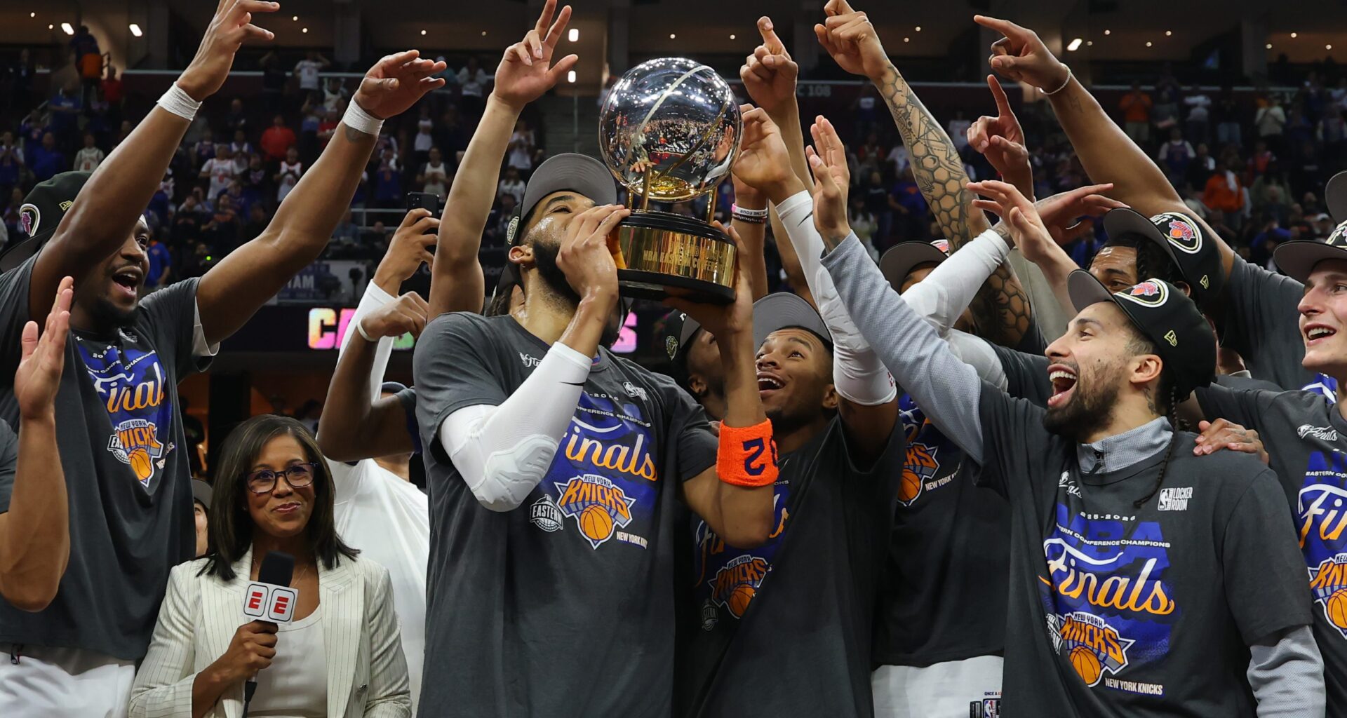 The New York Knicks celebrate with the Bob Cousy Trophy