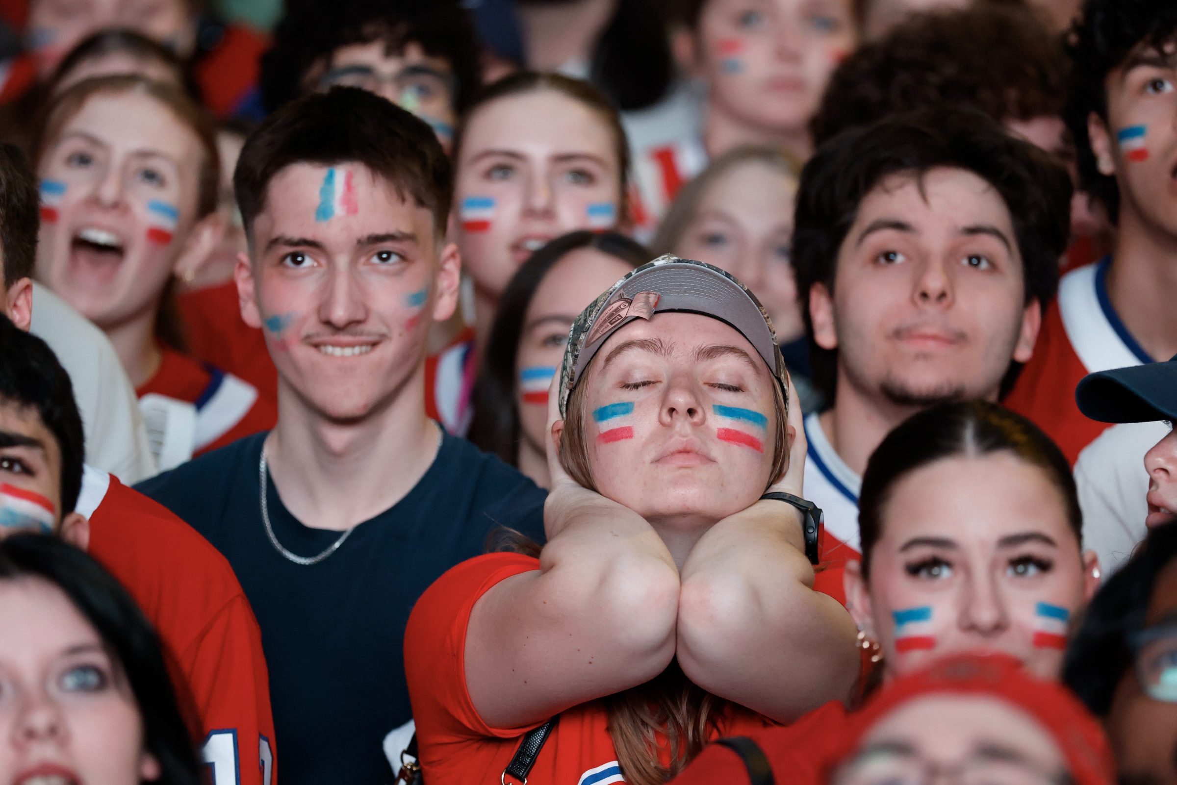 Canadiens fans react as they watch Game 4 against the Carolina Hurricanes outside the Bell Centre in Montreal on Wednesday.